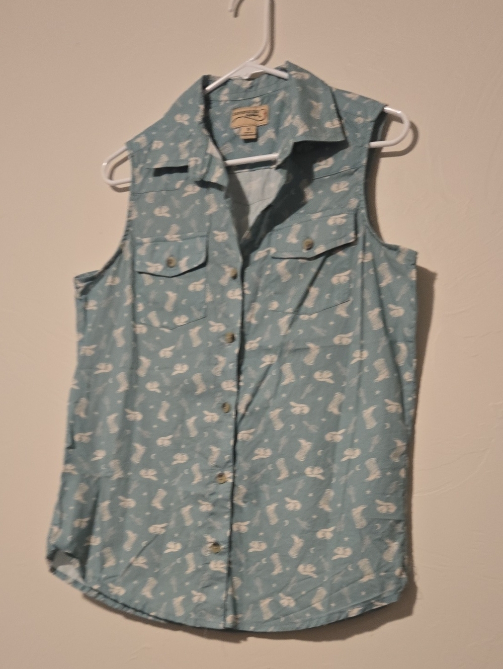 Sleeveless Button-Down Shirt in Light Blue with White Floral Motif